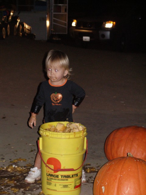 Payton - up to her armpits in pumpkin goooo