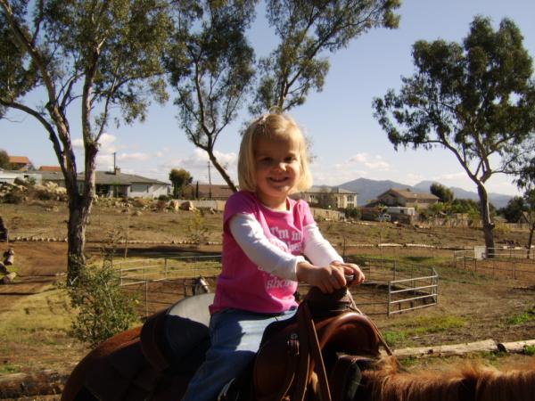 Paige & Kaylin riding Kisses with Grandma Carla