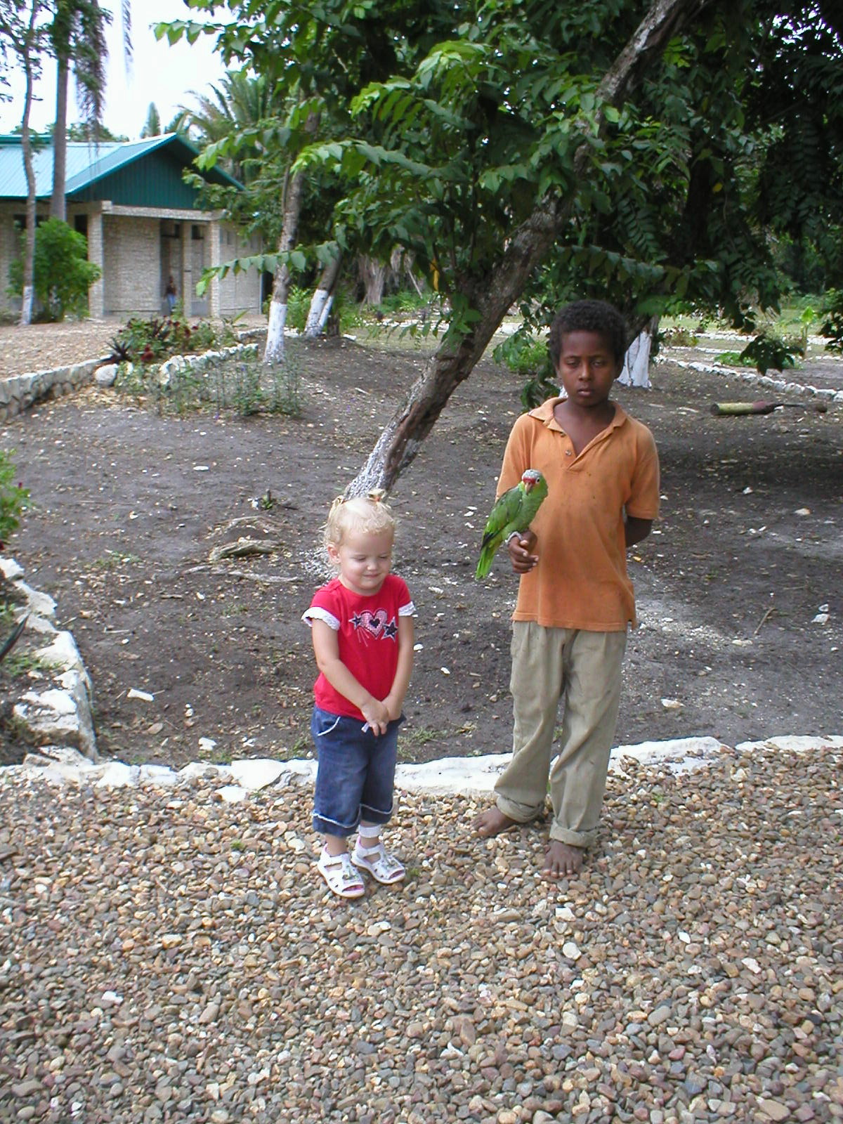 Belize - Altun Ha Mayan Ruins - Kaylin & a local kid with a parrot