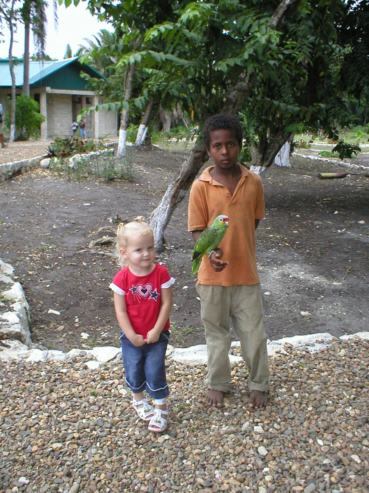 Belize - Altun Ha Mayan Ruins - Kaylin & a local kid with a parrot