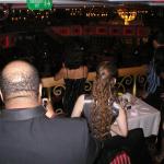 Maybe Christine should share some hair?  Really they're watching the waiters dance.