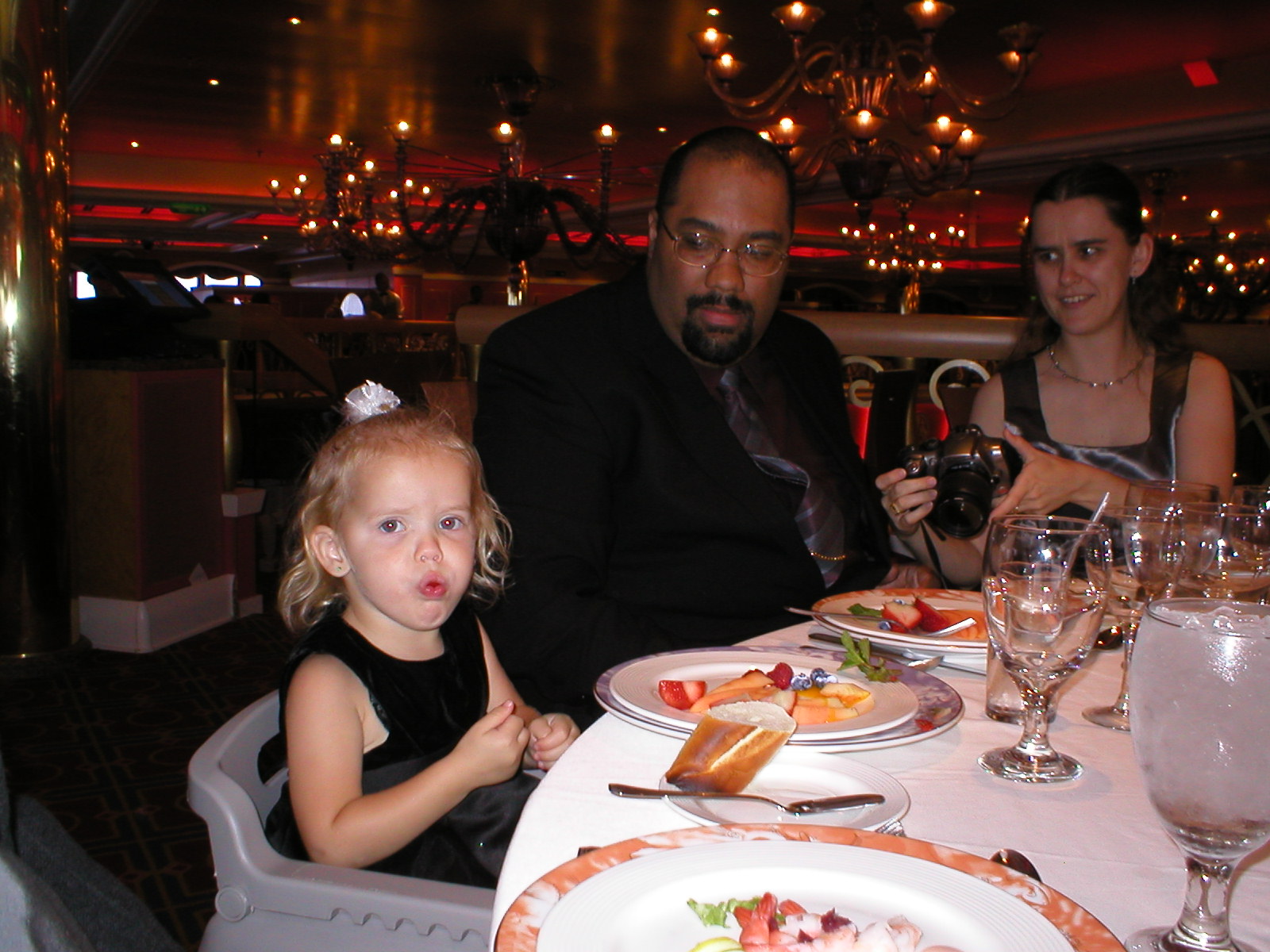 Kaylin stuffing her face at formal night... with onlookers.